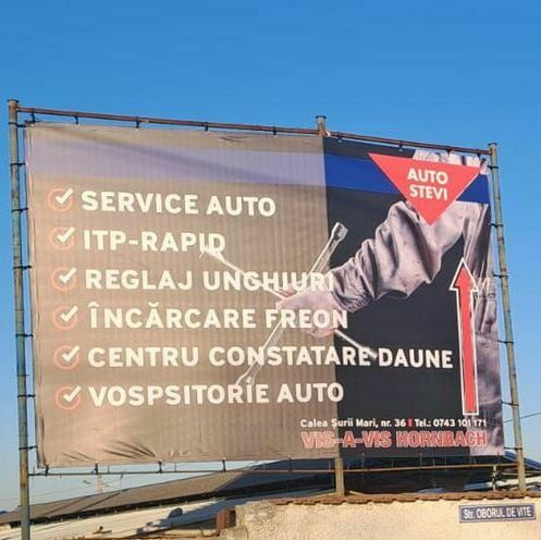 Banner de mari dimensiuni realizat și montat de Media Impact pentru firmă de reparații auto, publicitate exterioară eficientă.